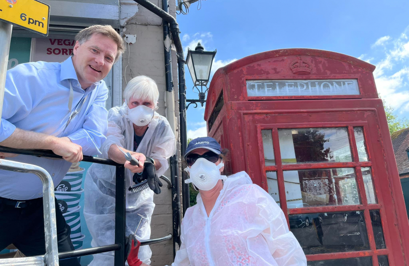 Pictured; Steve Brine MP with Councillor Sue Cook and Dr Ingrid Percival in front of the Twyford Crossroads telephone box.