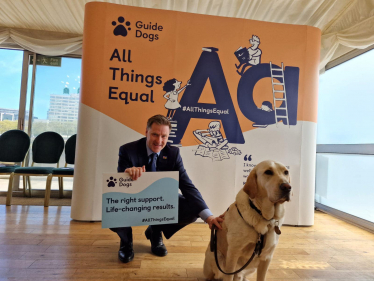 Pictured; Steve Brine MP with guide dog, Webb.