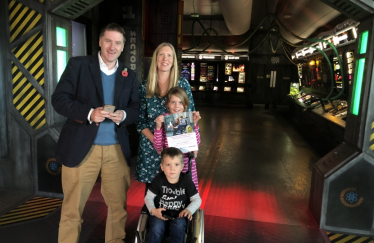 Pictured; Steve Brine MP with campaigner Finn and his family in 2018.